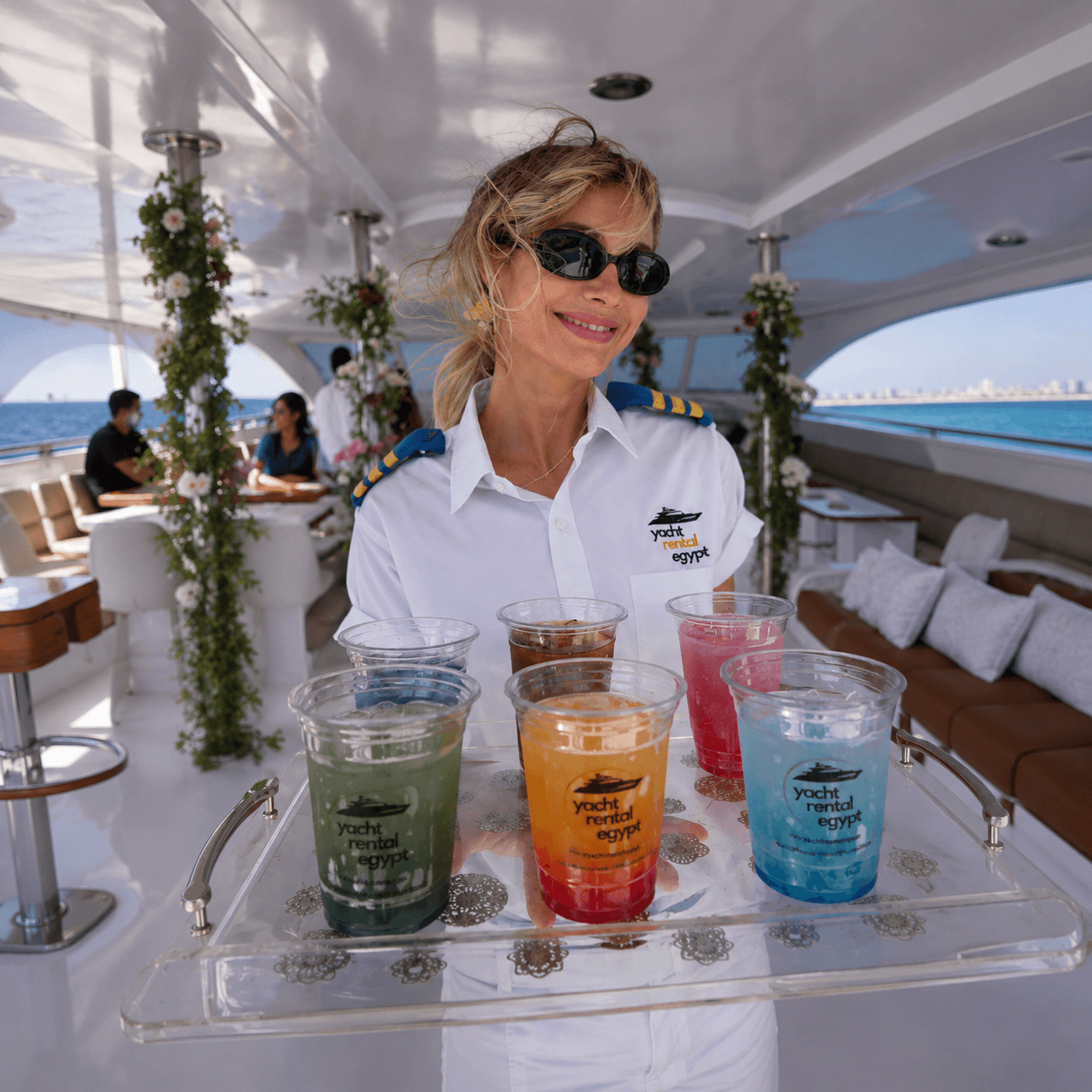 Crew member preparing drinks on board